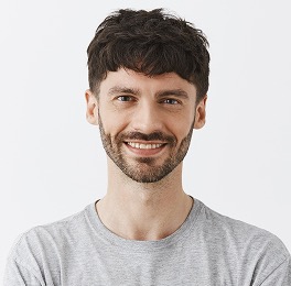 Photo of the team member 4. Caucasian bearded man in a grey T-shirt.